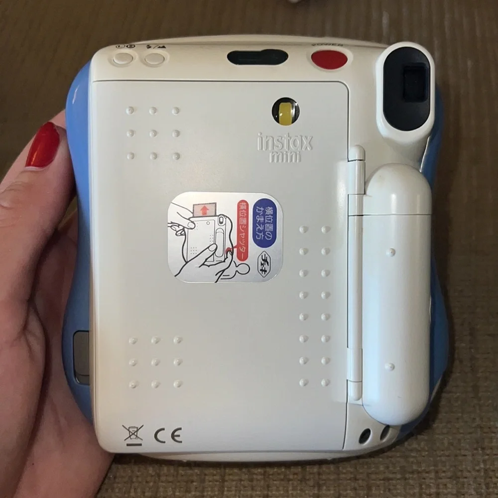 Fuji Film Instax camera with accessories